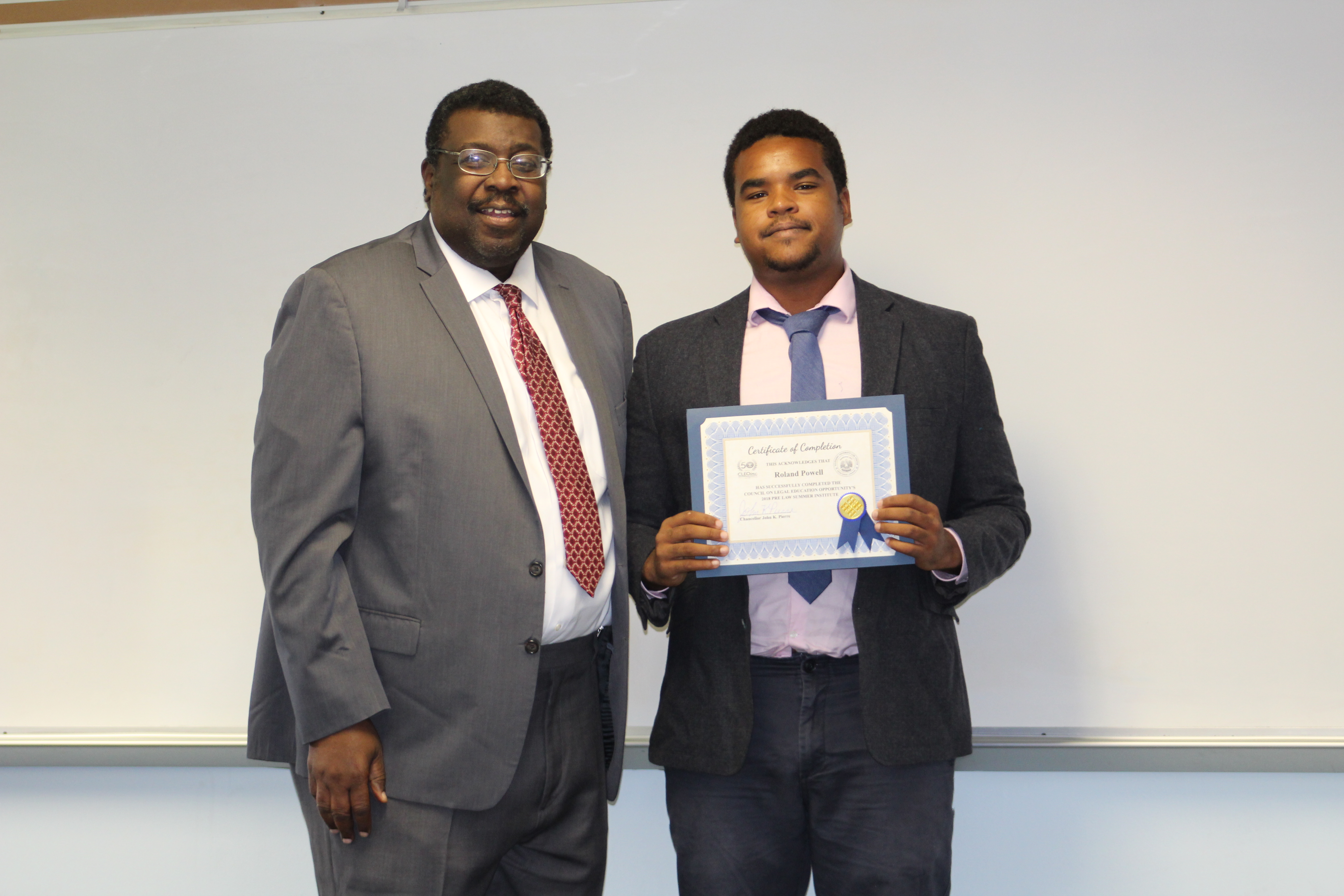 Graduates receive their certificate