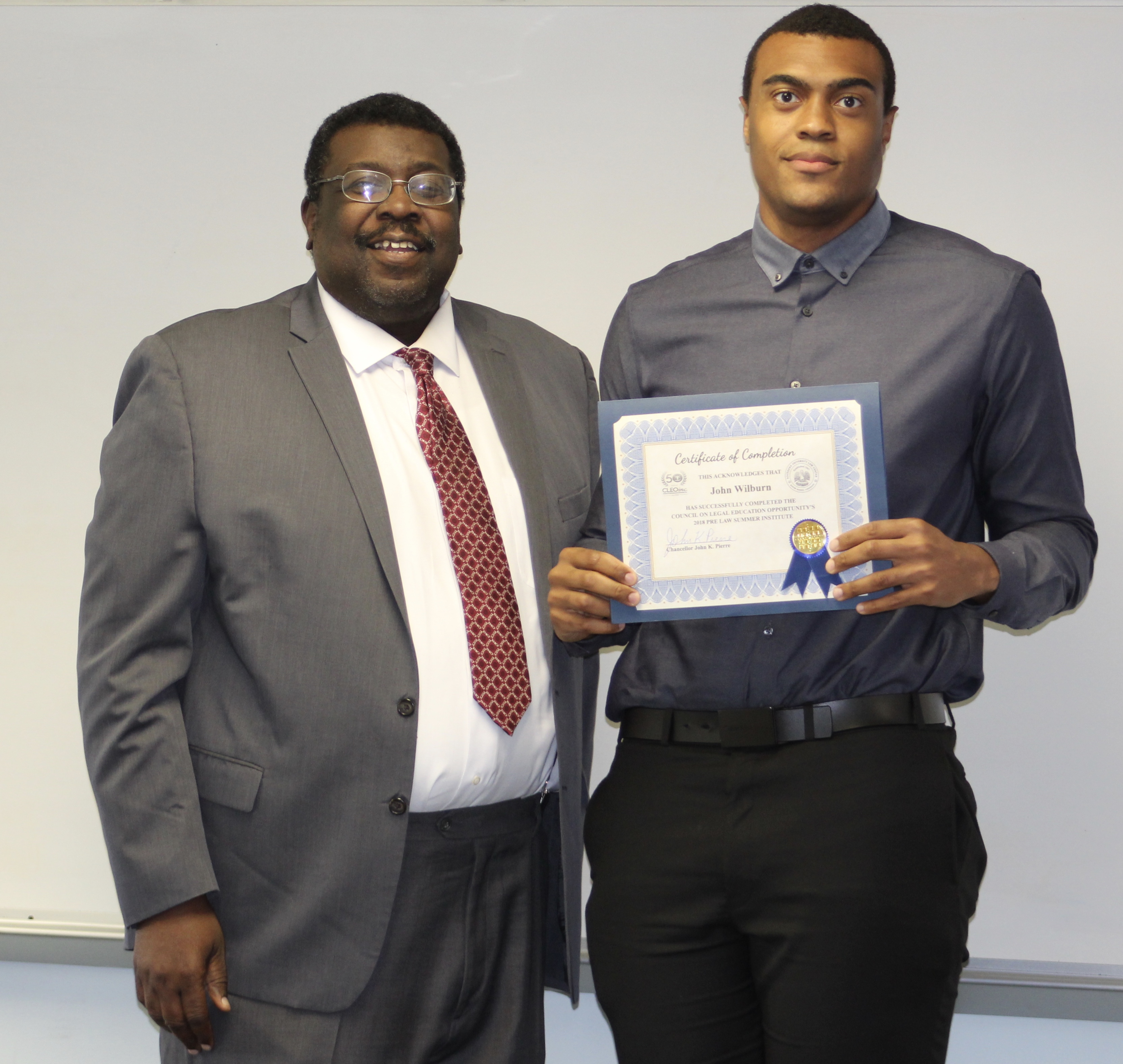 Graduates receive their certificate