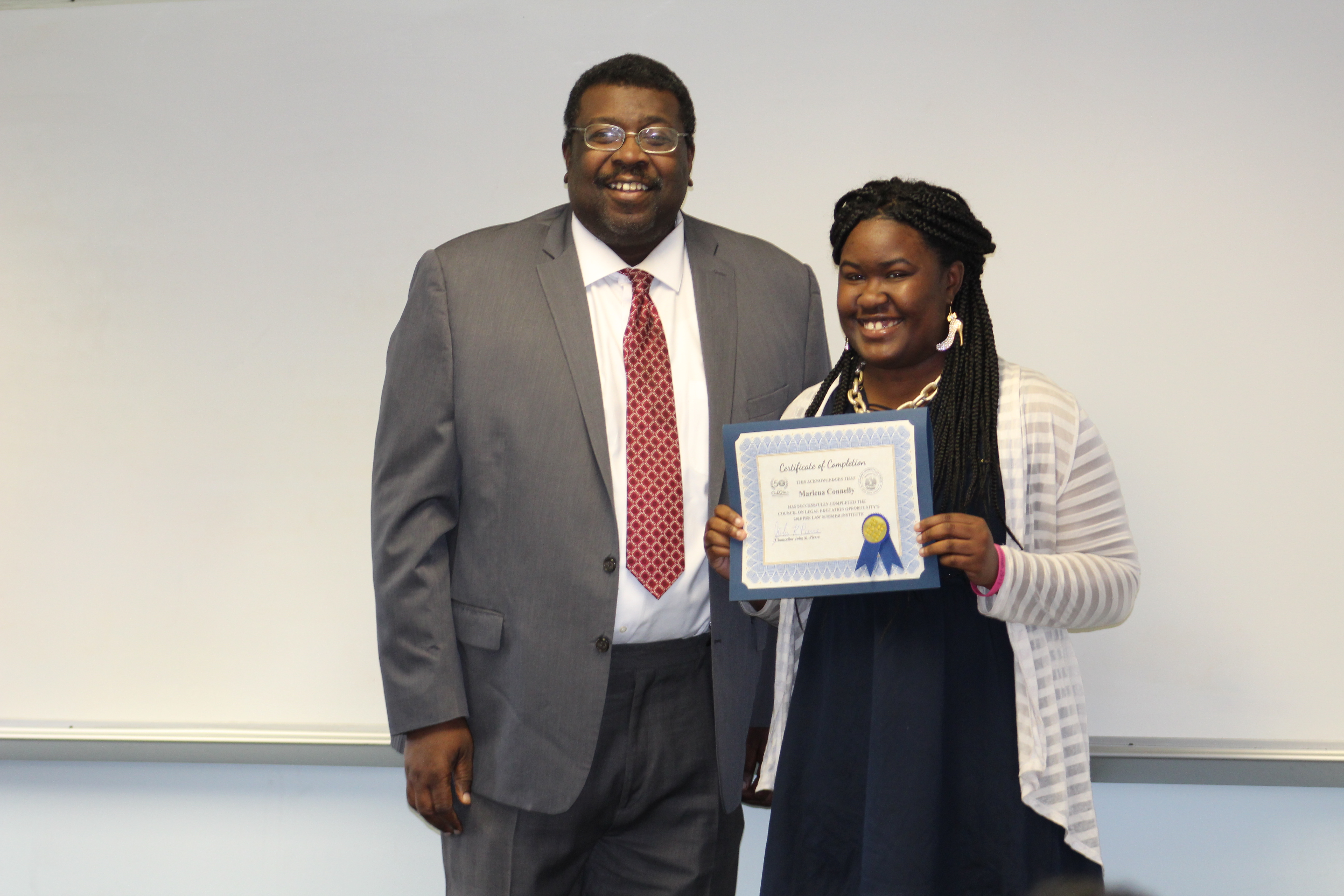 Graduate receives their certificate